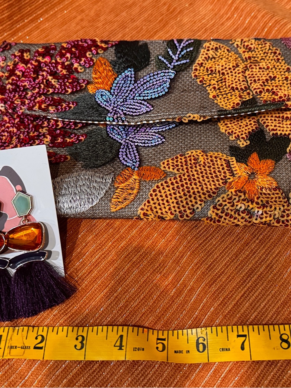 Embroidered Sequin Floral Clutch - Purple & Orange paired with earrings